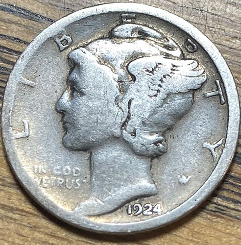 1924 Mercury dime die crack error showing a raised line running from the rim across the coin surface